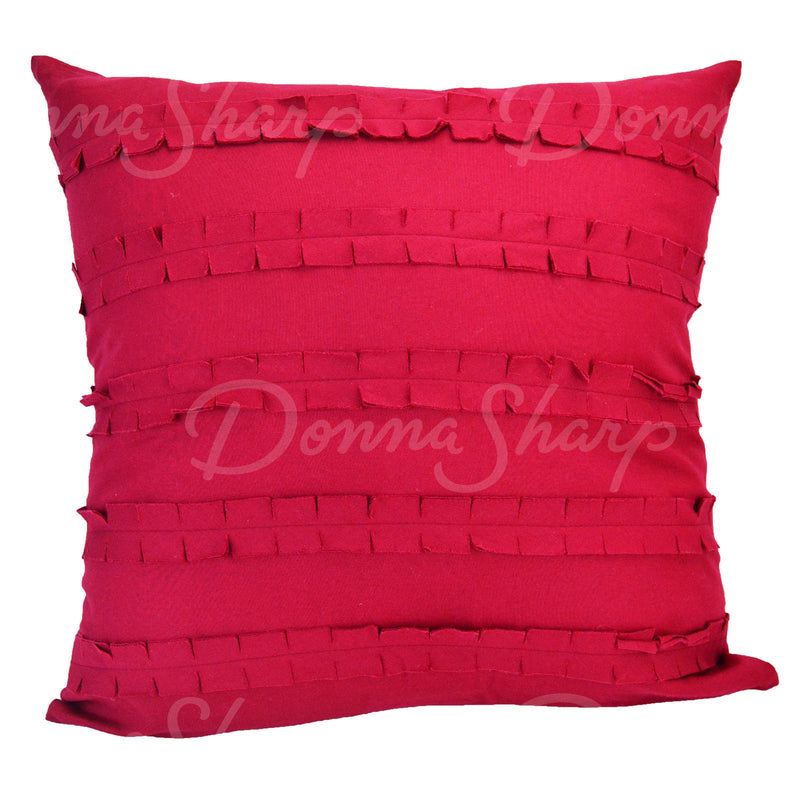 The front of this decorative pillow has a fun red ruffle design.